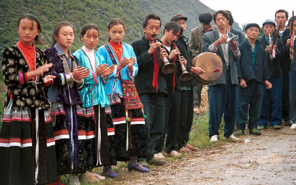 Welcoming party of Side comb Miao girls and male musicians at the entrance to Long Dong village, De Wo township, Longlin country, Guangxi province 0010d24A.jpg