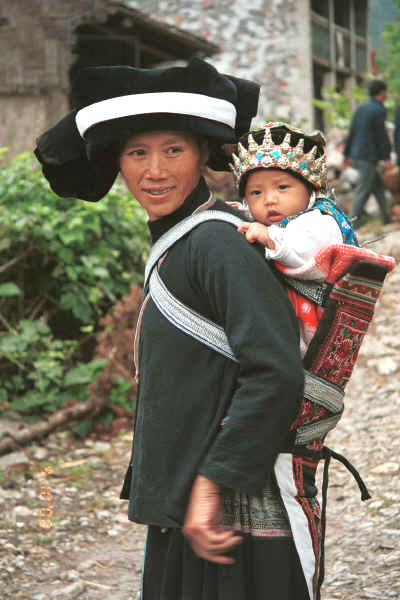Side comb Miao woman and baby in their festival finery, Long Dong village, De Wo township, Longlin country, Guangxi province 0010d33.jpg