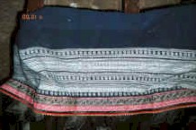 Jpeg 38K Top of Side comb Miao woman's skirt showing the indigo batik and inset strip of embroidery - Long Dong village, De Wo township, Longlin country, Guangxi provinc 0010e24.jpg